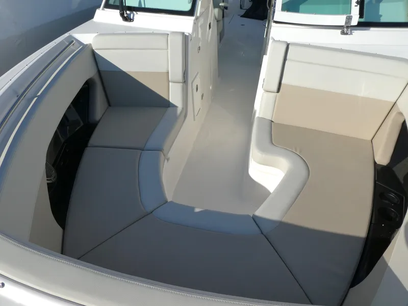 Slide: The Image of 2025 Boston Whaler 280 Vantage boat interior with spacious seating area. - 10