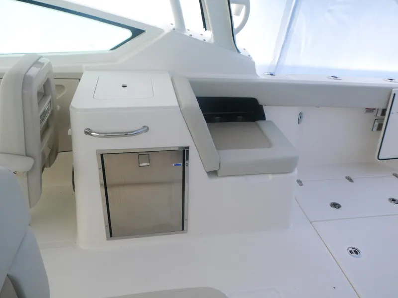 Slide: The Image of Interior of 2025 Boston Whaler 280 Vantage boat, featuring sleek seating and storage. - 14