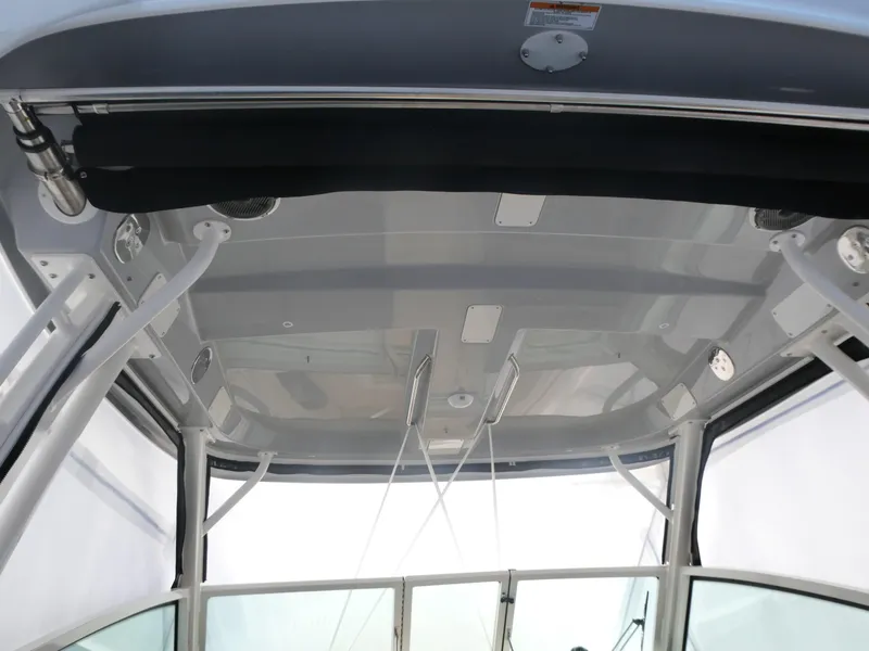 Slide: The Image of Interior view of 2025 Boston Whaler 280 Vantage boat's roof and support structure. - 3