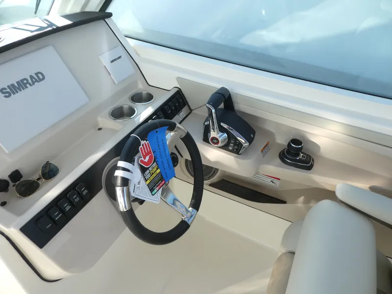 Slide: The Image of 2025 Boston Whaler 280 Vantage helm with Simrad electronics and modern controls. - 7