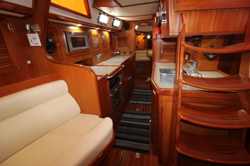 Slide: The Image of Luxurious interior of 2006 Hylas 49 Center Cockpit yacht with wood finish and modern amenities. - 11