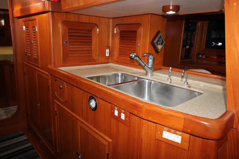 Slide: The Image of Wooden kitchen interior of 2006 Hylas 49 Center Cockpit with double sink. - 13