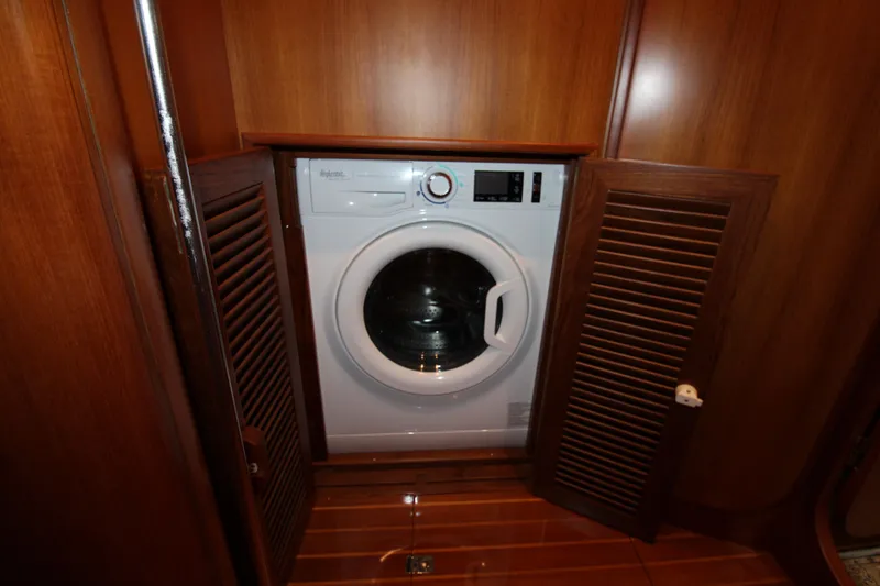 Slide: The Image of Washing machine in 2006 Hylas 49 Center Cockpit yacht's wooden interior. - 18