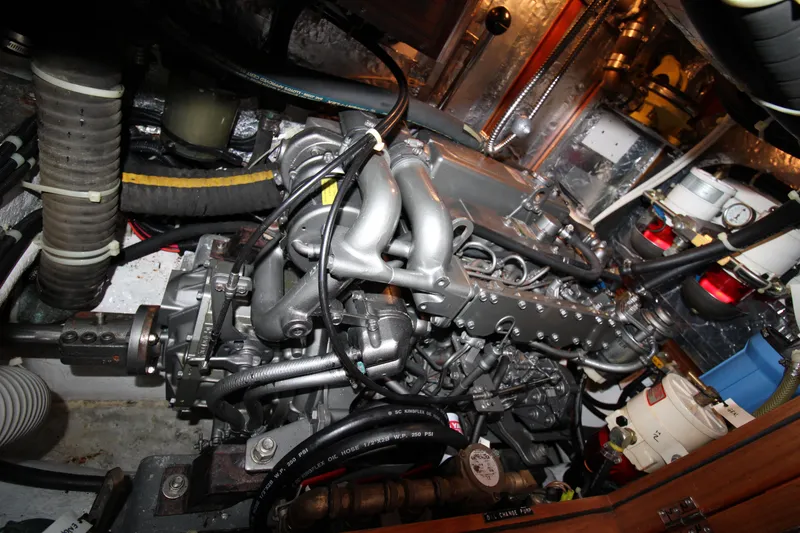 Slide: The Image of Engine compartment of a 2006 Hylas 49 Center Cockpit sailboat, showcasing mechanical components. - 20