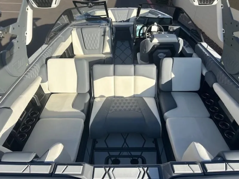 Slide: The Image of Luxurious interior of 2025 Malibu M230 boat with spacious seating and modern design. - 18