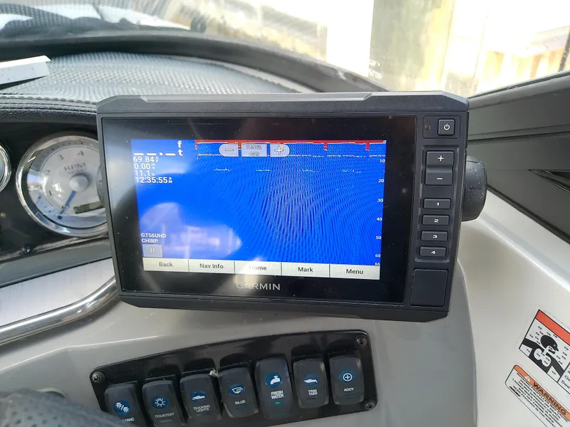 Slide: The Image of Garmin navigation system on 2021 Stingray 214 LR boat dashboard. - 25