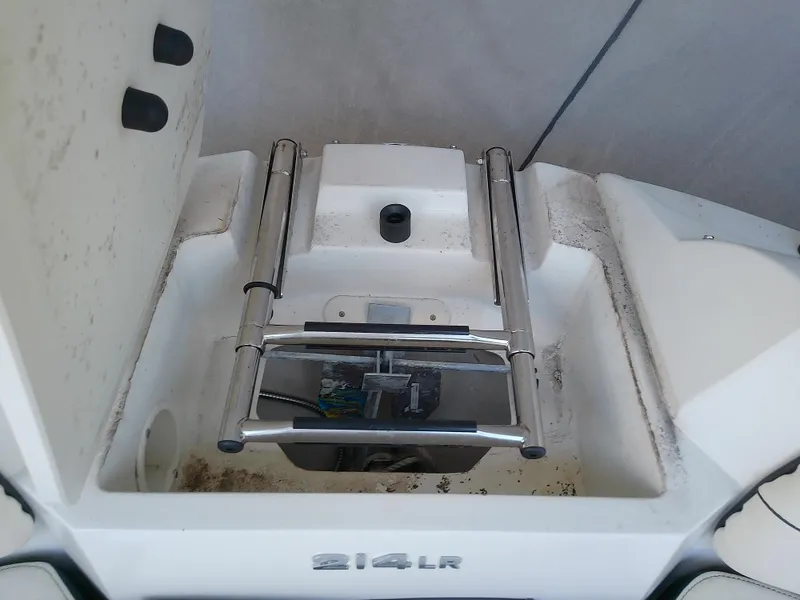 Slide: The Image of 2021 Stingray 214 LR boat ladder and storage compartment. - 36