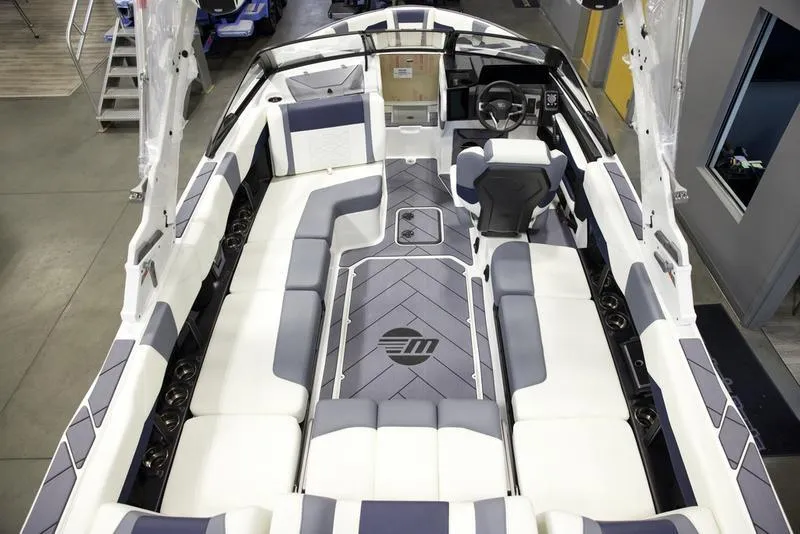 Slide: The Image of 2025 Malibu 23 LSV boat interior with modern seating and sleek design. - 10