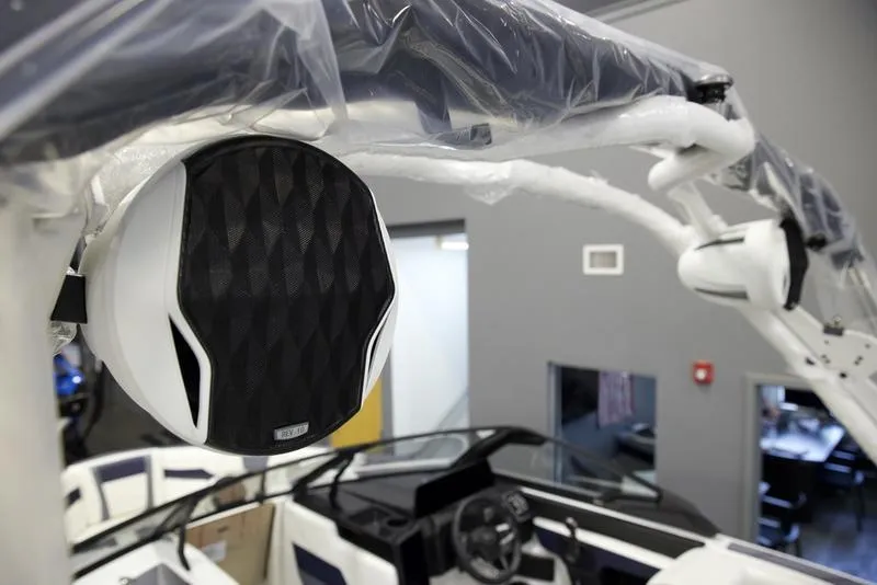 Slide: The Image of 2025 Malibu 23 LSV boat interior with premium audio system and sleek design. - 11