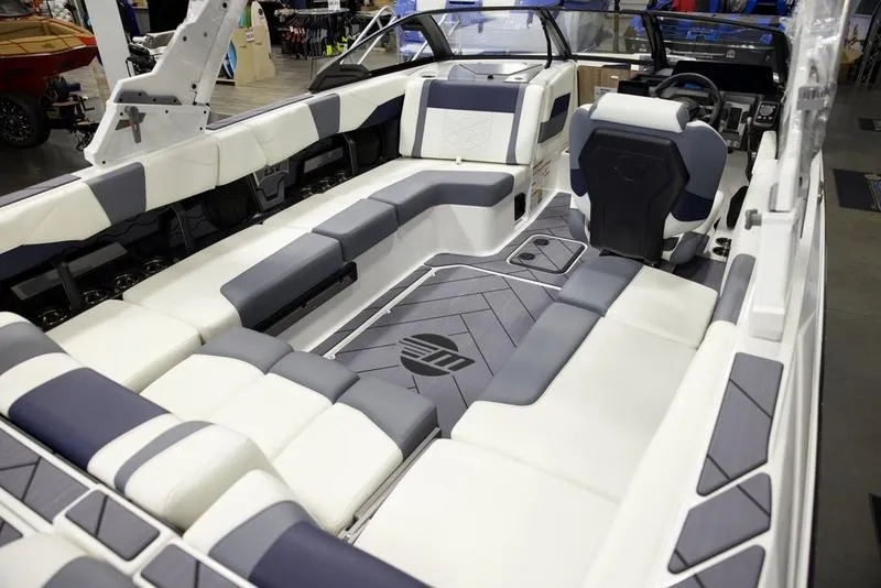 Slide: The Image of 2025 Malibu 23 LSV boat interior with sleek, modern seating and stylish design. - 17