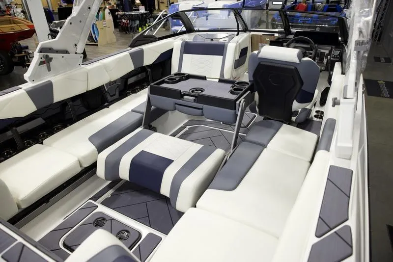 Slide: The Image of 2025 Malibu 23 LSV boat interior with modern seating and sleek design. - 18