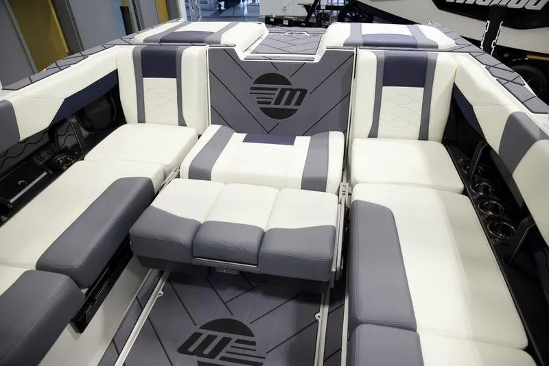 Slide: The Image of 2025 Malibu 23 LSV boat interior with luxurious seating and modern design. - 21