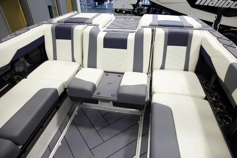 Slide: The Image of Luxurious interior of 2025 Malibu 23 LSV boat with stylish seating. - 22