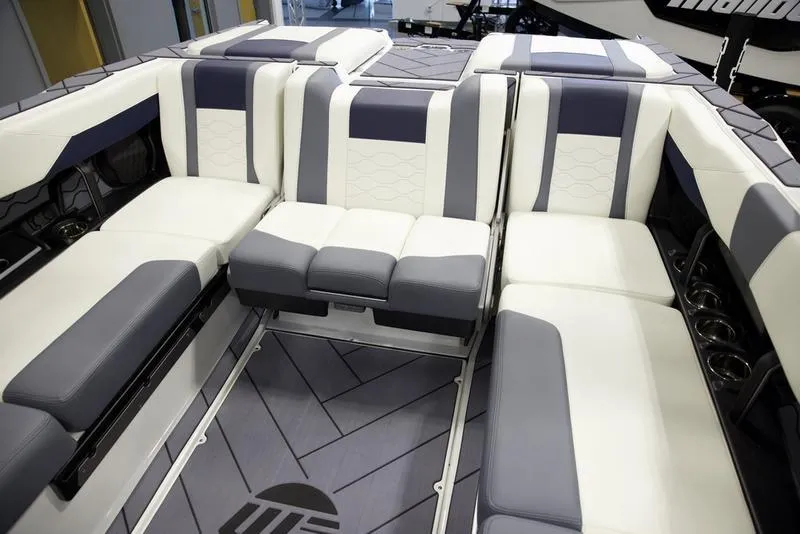 Slide: The Image of Interior of 2025 Malibu 23 LSV boat with modern seating and sleek design. - 23