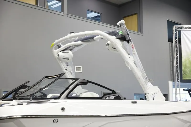 Slide: The Image of 2025 Malibu 23 LSV boat with sleek design and modern features. - 8