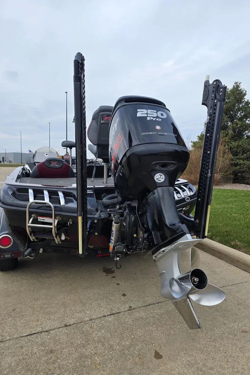 Slide: The Image of 2017 Ranger Z520C boat with powerful 250 HP engine, parked on concrete. - 2
