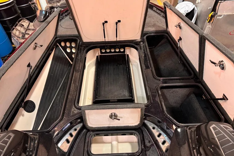 Slide: The Image of 2017 Ranger Z520 Comanche boat interior with open storage compartments and sleek design. - 7