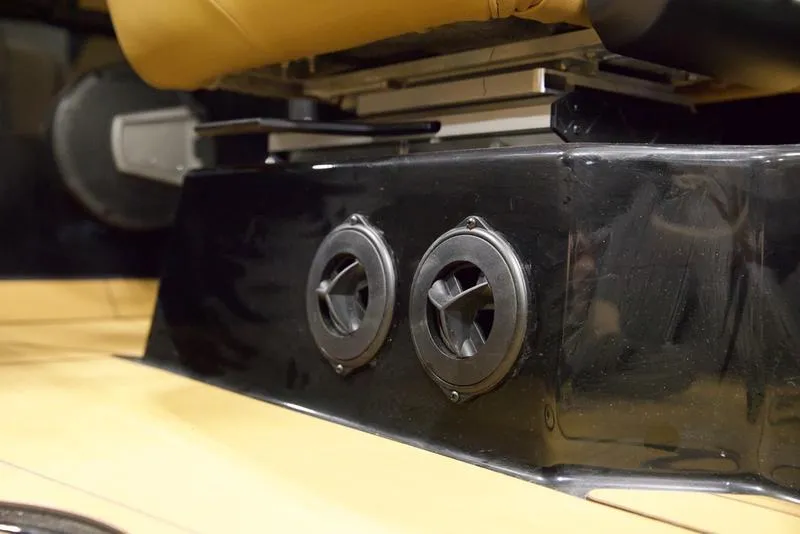 Slide: The Image of 2025 Axis T250 boat interior with dual air vents and tan seating. - 14