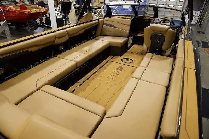 Slide: The Image of Luxurious interior of 2025 Axis T250 boat with tan seating and modern design. - 15