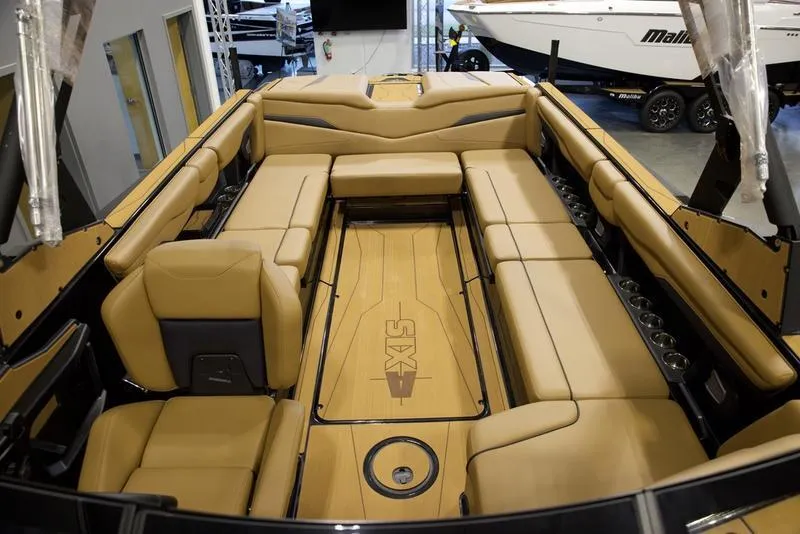 Slide: The Image of Luxurious interior of 2025 Axis T250 boat with tan seating and sleek design. - 18
