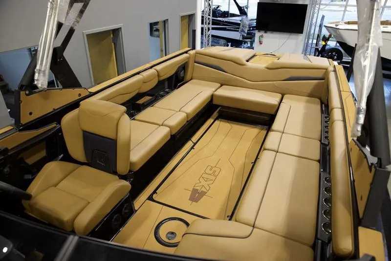 Slide: The Image of Luxurious interior of 2025 Axis T250 boat with tan seating and spacious layout. - 19