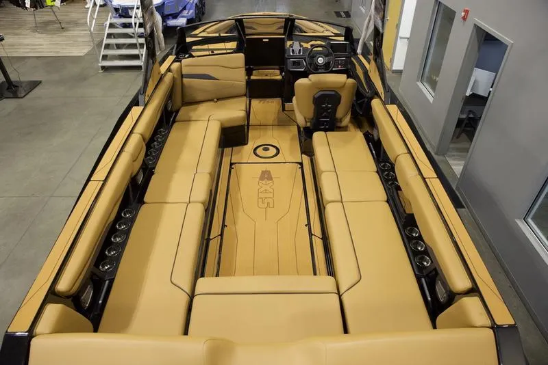 Slide: The Image of Luxurious interior of 2025 Axis T250 boat with tan seating and modern design. - 8