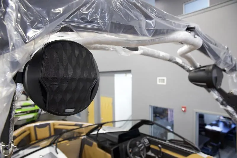 Slide: The Image of 2025 Malibu 25 LSV boat interior with premium audio system and sleek design. - 14