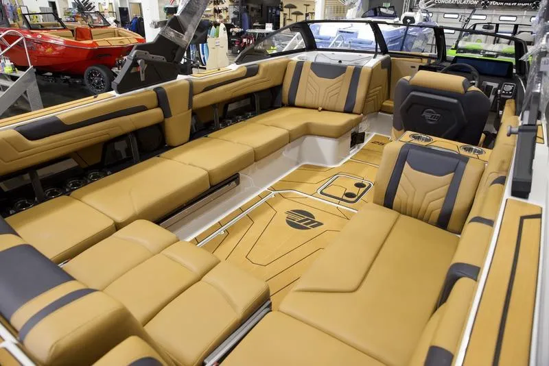 Slide: The Image of Luxurious interior of 2025 Malibu 25 LSV boat with tan leather seating. - 20