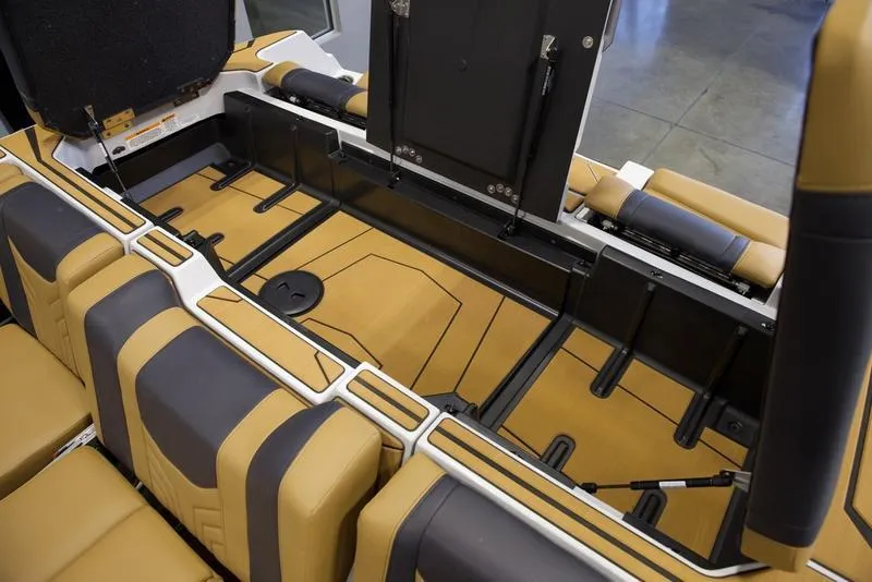 Slide: The Image of 2025 Malibu 25 LSV interior seating with tan and black upholstery. - 30