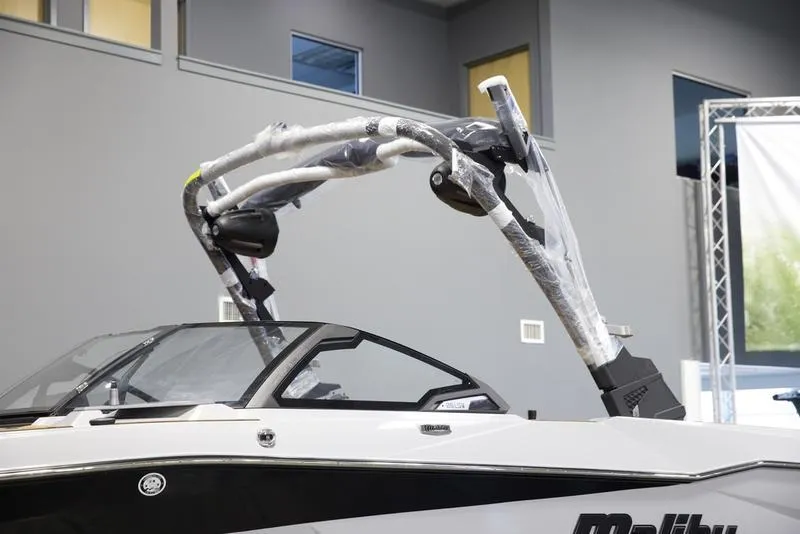 Slide: The Image of 2025 Malibu 25 LSV boat with sleek design and modern features. - 8