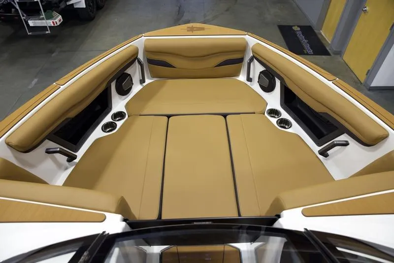 Slide: The Image of 2025 Axis T250 boat interior with tan seating and modern design. - 15