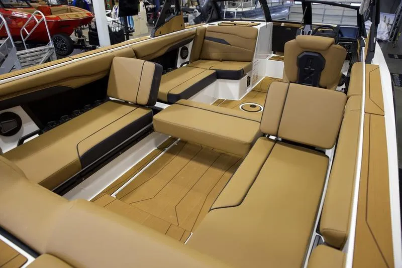 Slide: The Image of 2025 Axis T250 boat interior with tan seating and modern design. - 18