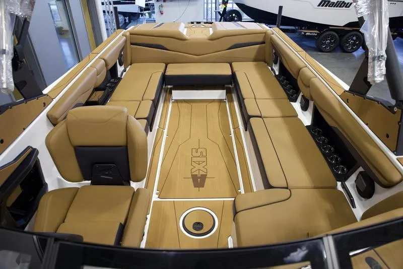 Slide: The Image of 2025 Axis T250 boat interior with tan seating and sleek design. - 21