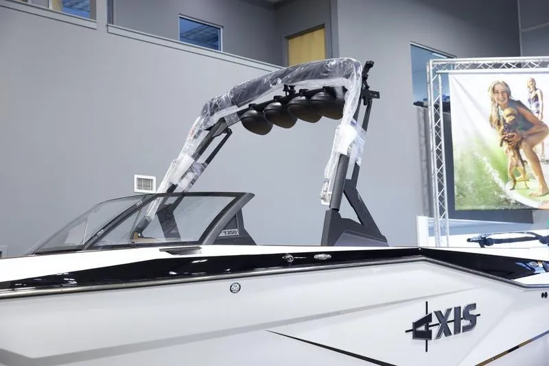 Slide: The Image of 2025 Axis T250 boat with wakeboard tower in showroom. - 6