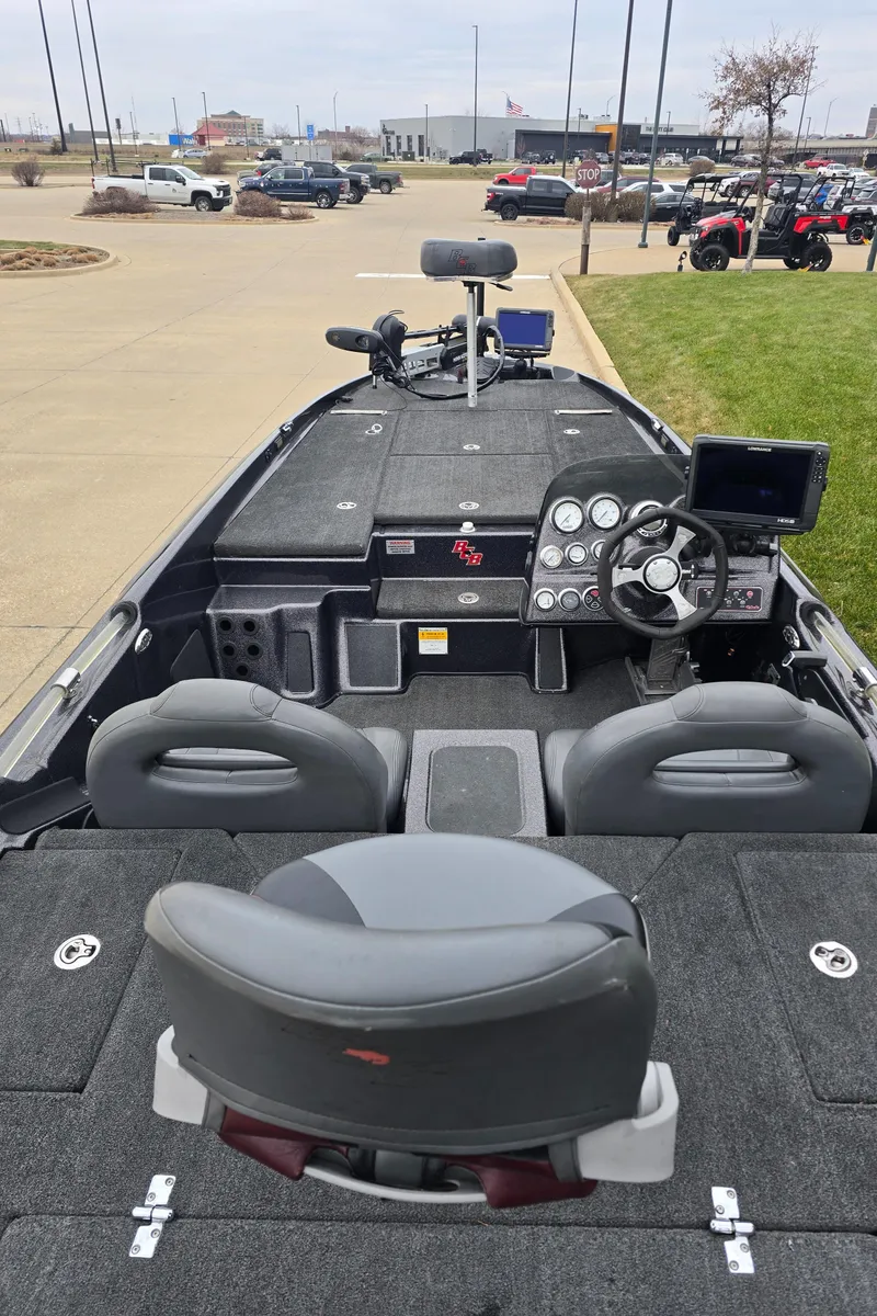 Slide: The Image of 2010 Bass Cat Cougar FTD boat interior with steering console and seating. - 4