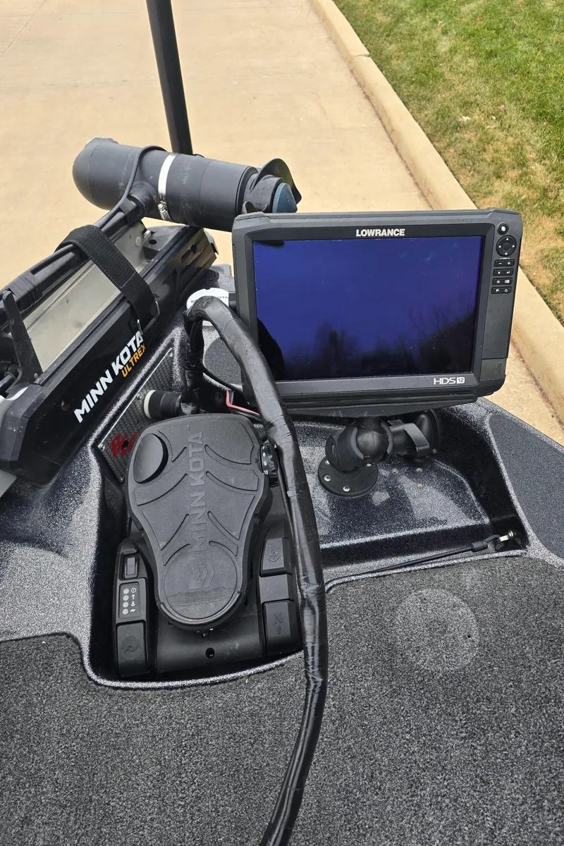 Slide: The Image of 2010 Bass Cat Cougar FTD boat dashboard with Minn Kota trolling motor and Lowrance fish finder. - 5