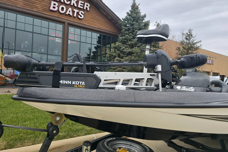 Slide: The Image of 2010 Bass Cat Cougar FTD boat with Minn Kota Ultrex motor outside Tracker Boats store. - 6