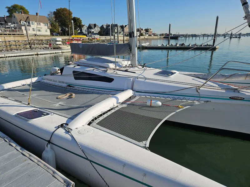Slide: The Image of Sailboat Corsair Dash 750 MKII - 92, 2013 model, docked at a marina. - 2