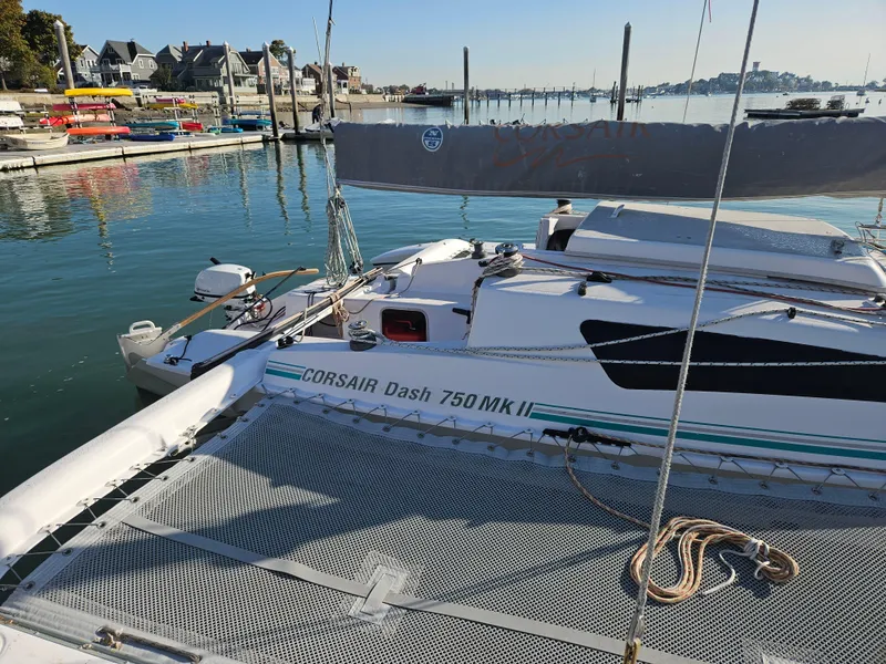 Slide: The Image of Corsair Dash 750 MKII sailboat docked at a marina, calm water, sunny day, 2013 model. - 3