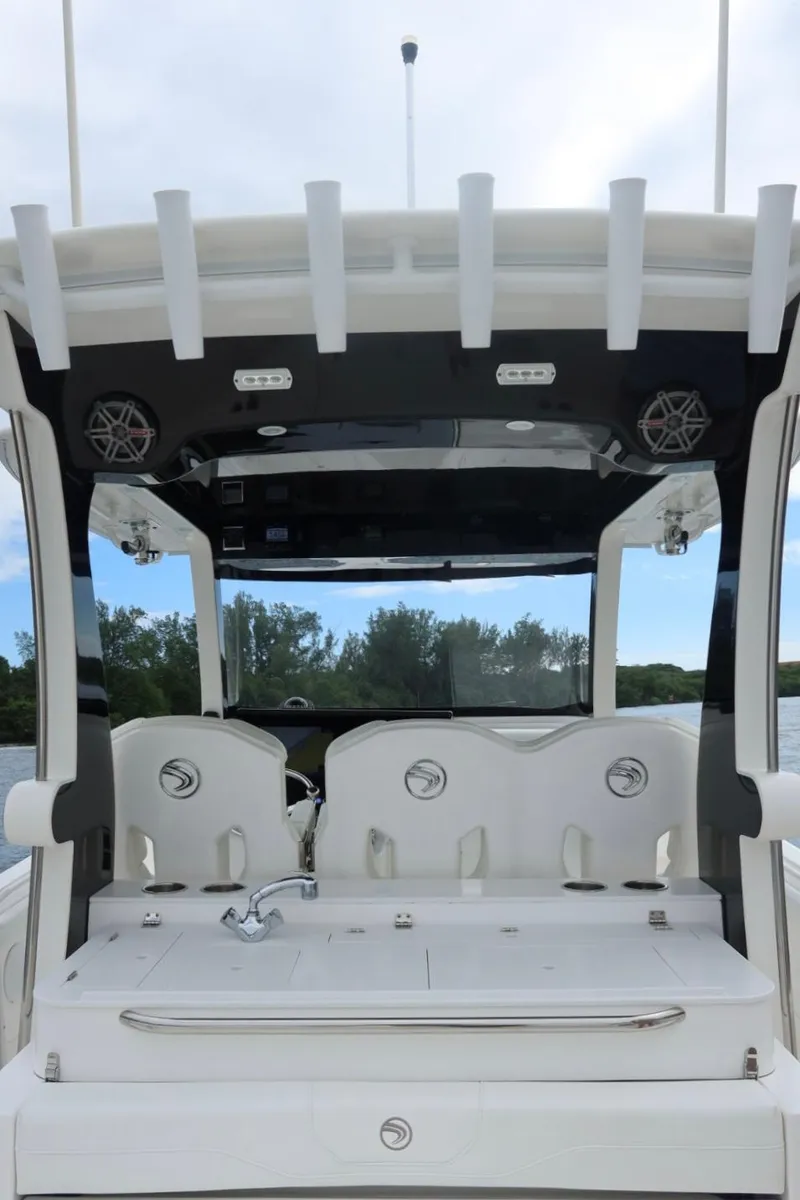 Slide: The Image of 2019 Edgewater 370CC boat interior with seating and canopy. - 19