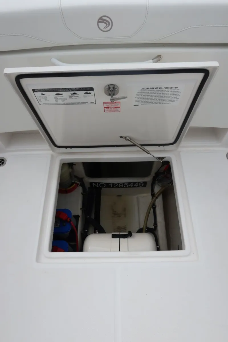 Slide: The Image of Open hatch of 2019 Edgewater 370CC boat showing internal compartment. - 20