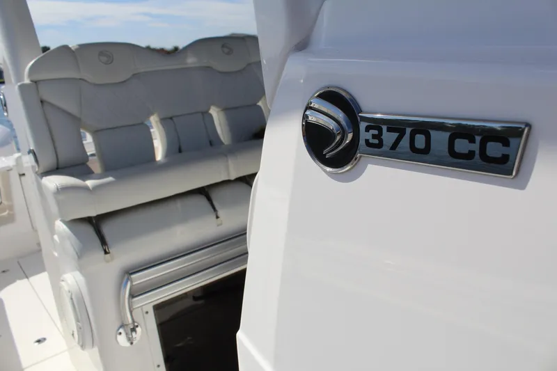 Slide: The Image of Edgewater 370CC 2019 boat interior with seating and logo detail. - 21