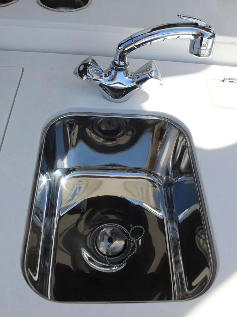 Slide: The Image of Stainless steel sink and faucet on 2019 Edgewater 370CC boat. - 23