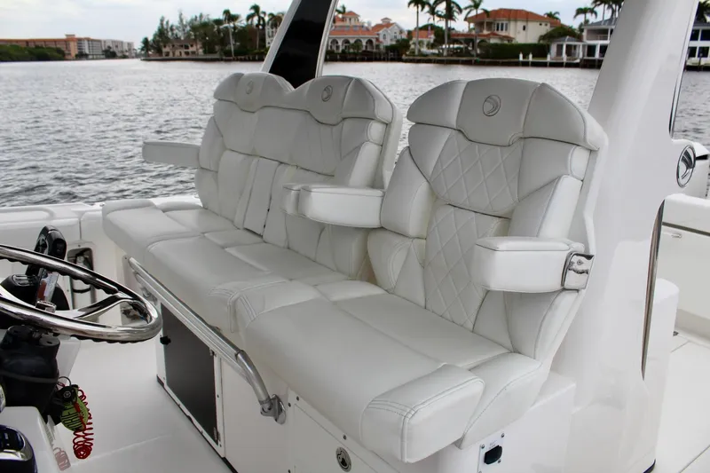Slide: The Image of Luxurious seating on 2019 Edgewater 370CC boat with waterfront view. - 33