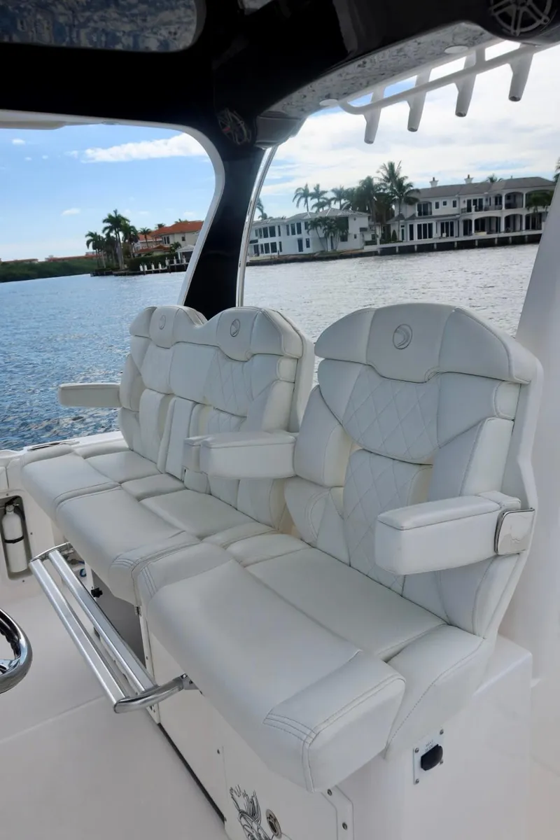 Slide: The Image of Luxurious seating on 2019 Edgewater 370CC boat with waterfront view. - 38