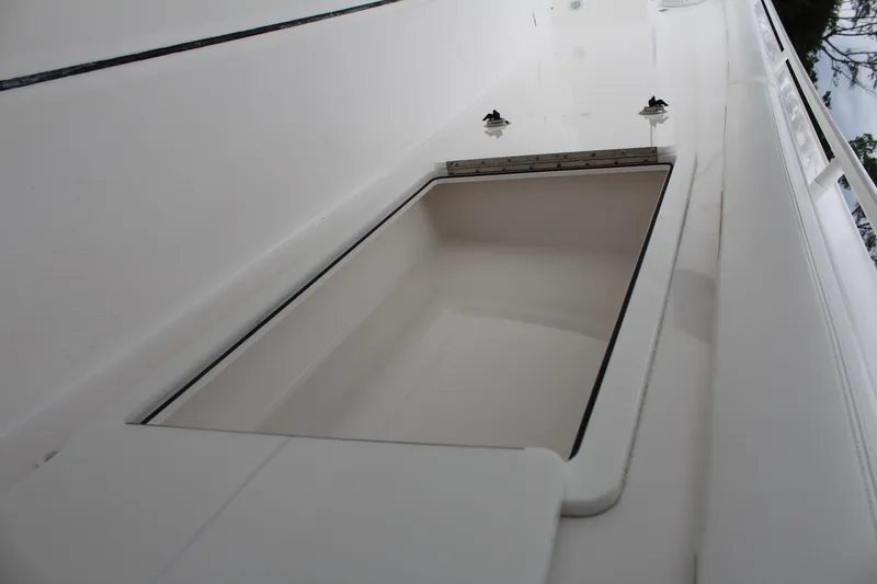 Slide: The Image of Edgewater 370CC 2019 boat storage compartment, open and empty. - 46