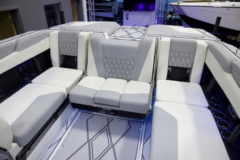 Slide: The Image of Luxurious interior seating of 2025 Malibu M242 boat with modern design. - 26