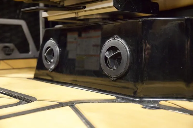 Slide: The Image of 2025 Malibu M230 boat interior speakers and flooring detail. - 18