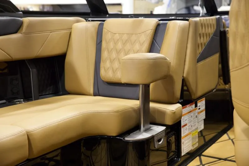 Slide: The Image of 2025 Malibu M230 interior with tan leather seating and modern design. - 32