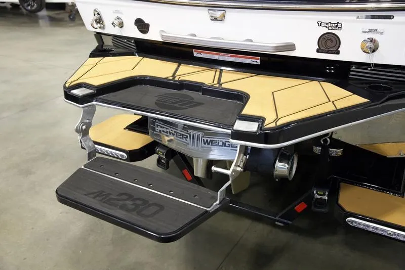 Slide: The Image of 2025 Malibu M230 boat rear platform with step and Power Wedge III feature. - 6